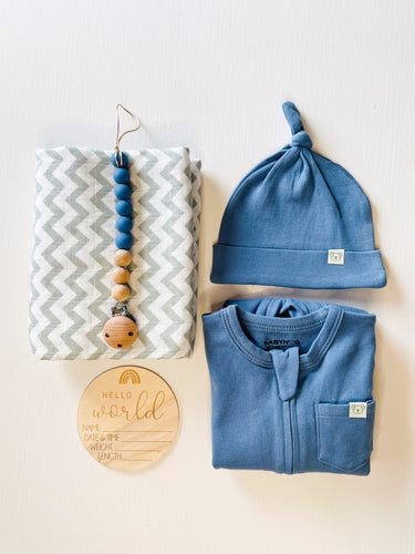 Organic blue baby gift box with sleepsuit, muslin wrap, and knot hat