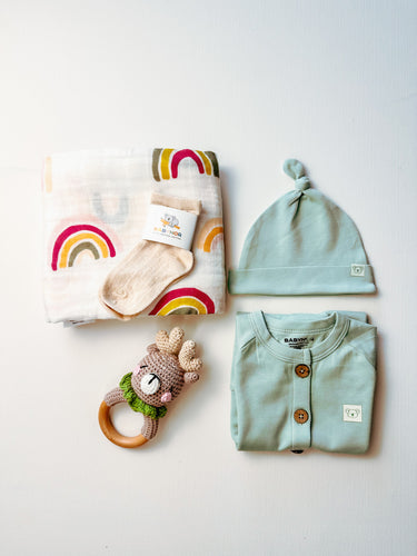 Organic Baby Gift BundleGender-neutral baby hamper in mint tones with crochet elk rattle
