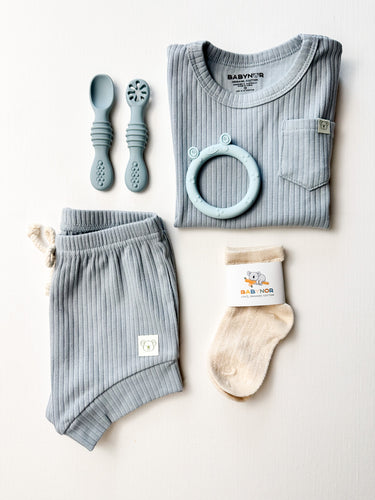 Organic toddler boy gift box with clothing, silicone set, and socks