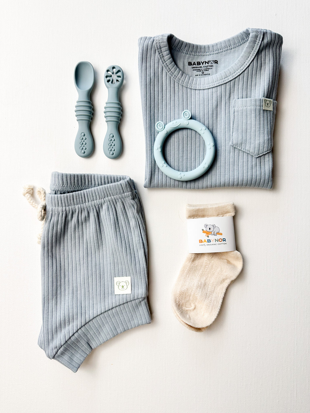 Organic toddler boy gift box with clothing, silicone set, and socks