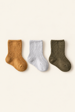 Load image into Gallery viewer, Babynor ribbed organic baby socks in mustard, white and olive on a warm ivory background
