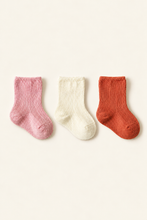 Load image into Gallery viewer, Babynor organic baby socks in pink, cream and terracotta on an ivory background
