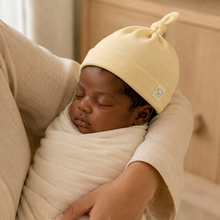 Load image into Gallery viewer, Organic Knot Hat - Yellow, lifestyle image
